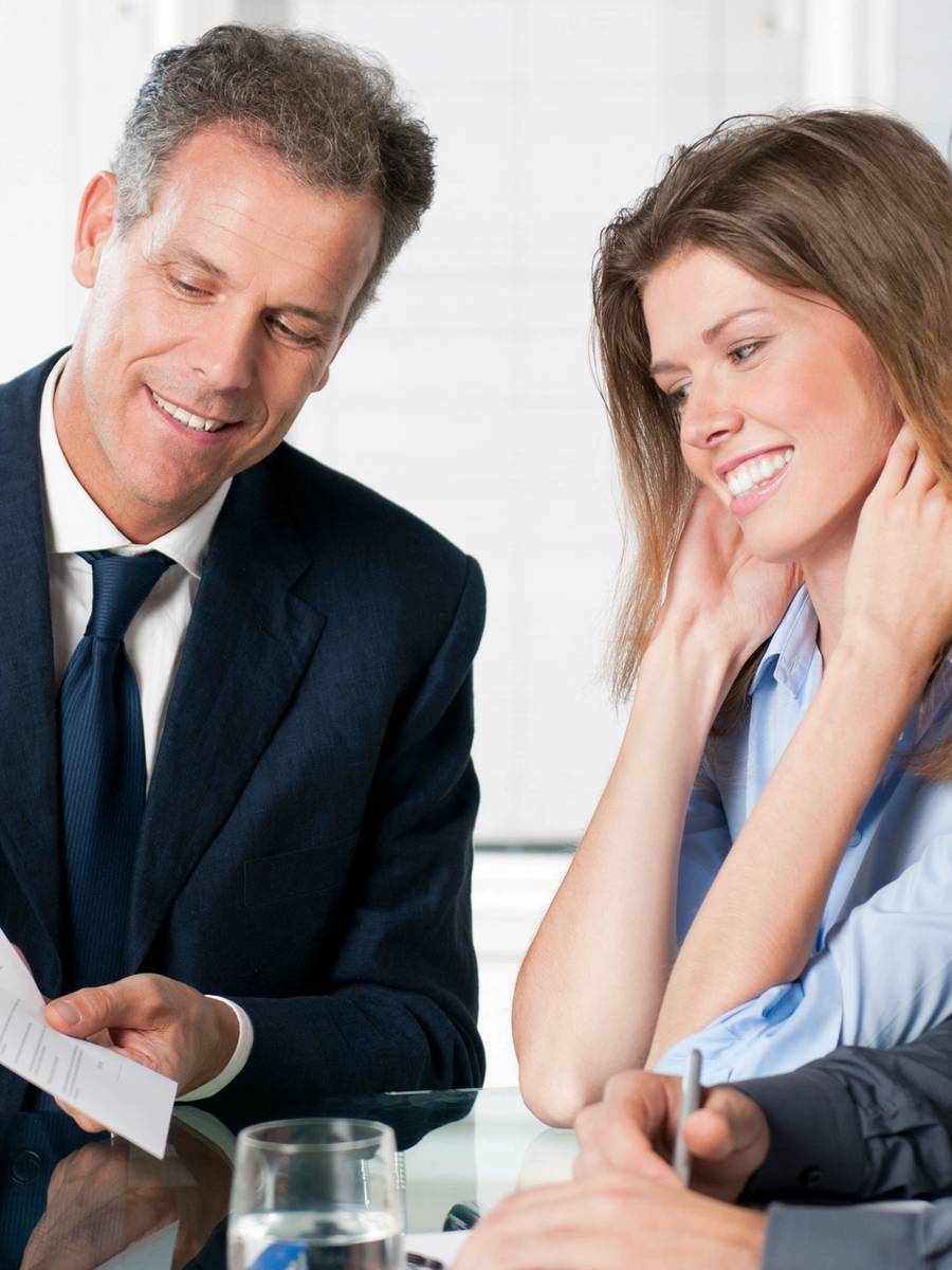 Professional insurance advisor with clients
